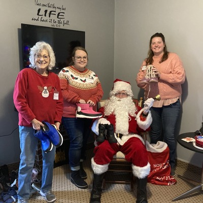 89 pairs of boots were collected and given out to PCOM children.  It was extra fun choosing boots with Santa! The Boot Drive is a great reminder of PC