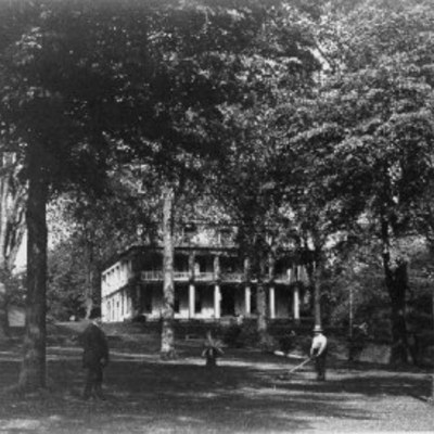 Exterior of the museum circa late 19th century showing established landscaping and grounds