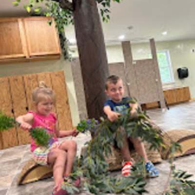 Children in the new preschool room under the tree.